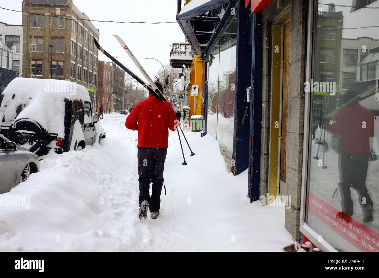 People walking through downtown Montreal with their cross country skis