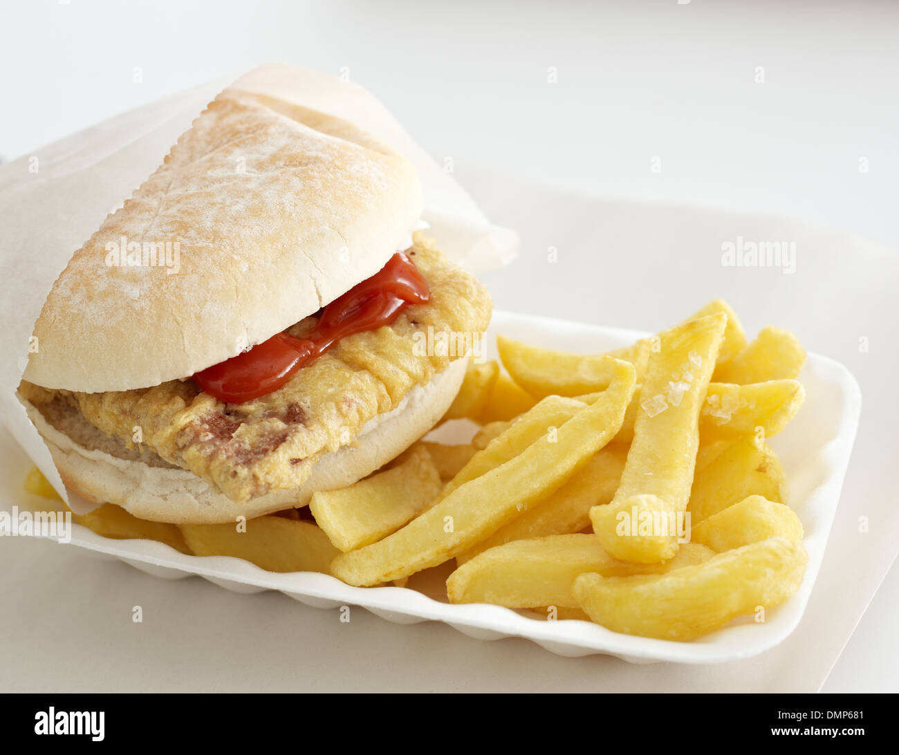 chips tray battered burger sauce paper takeaway Stock Photo