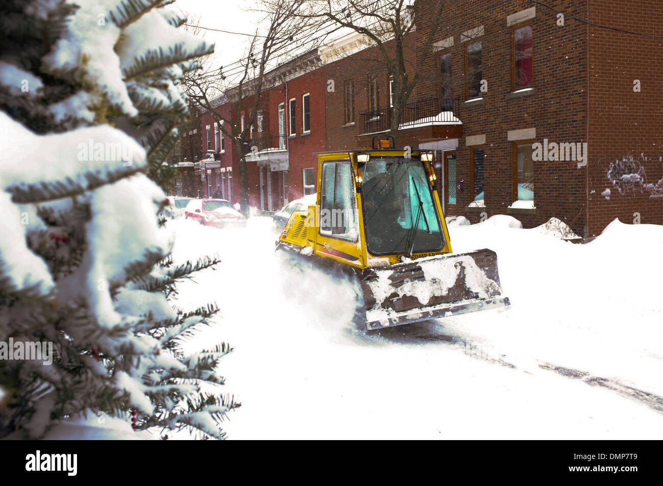 A sidewalk snow plow in Montreal's snow covered Plateau. Stock Photo