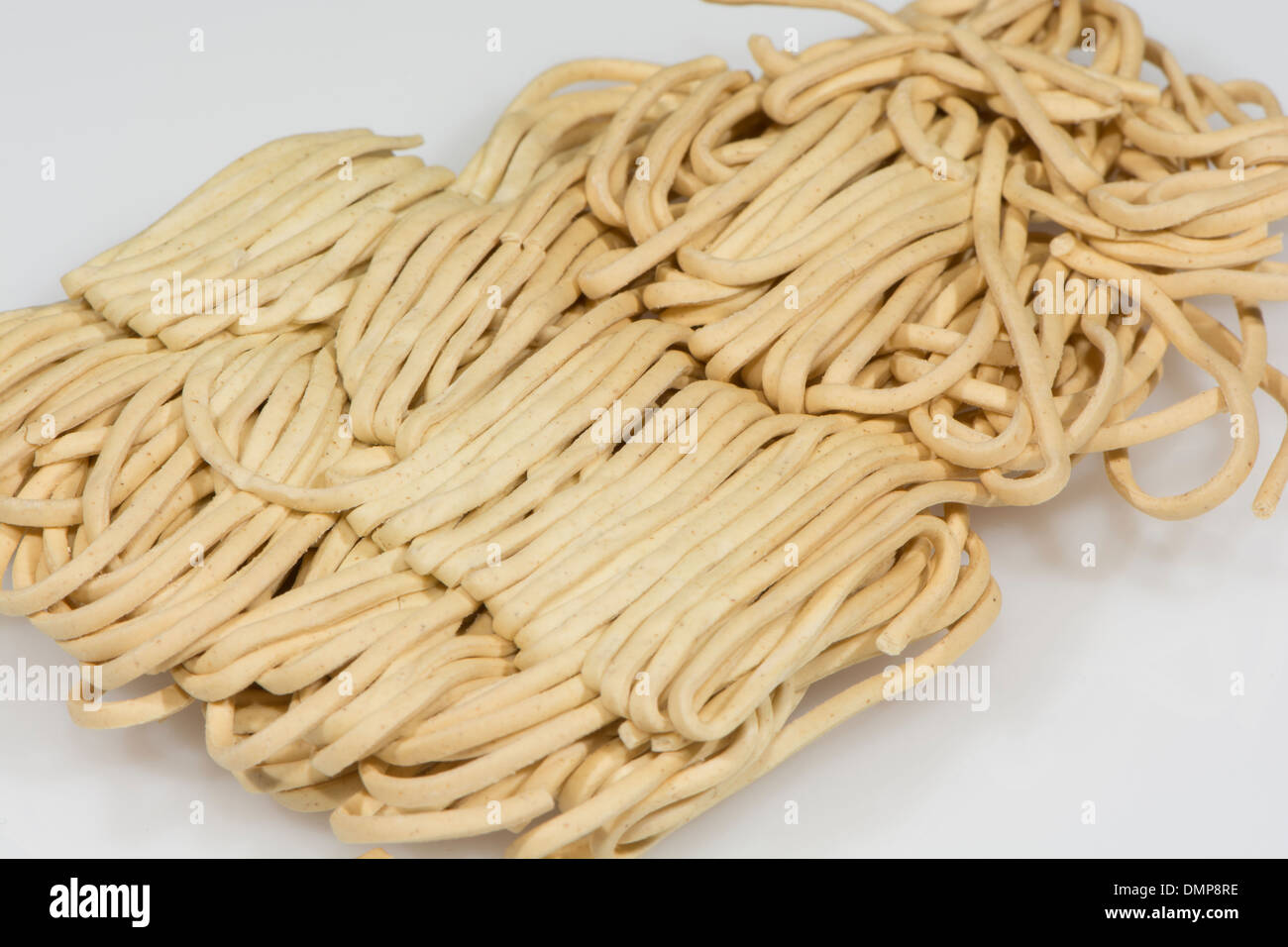 Close Up Of Dried Egg Noodles Isolated On A White Studio Background Stock Photo