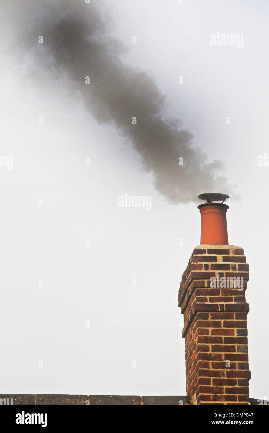 Smoking Chimney - domestic chimney smoking Stock Photo