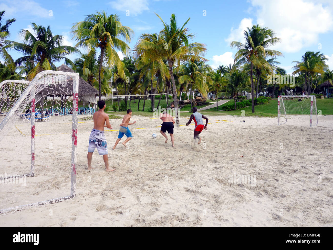 Young people playing soccer on a beach in Varadero, Cuba Stock Photo