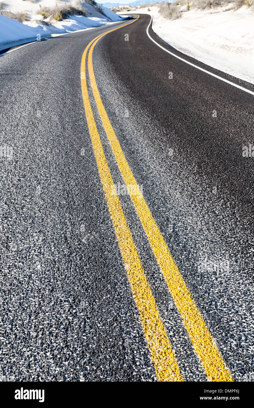 yellow dividing line on asphalt road Stock Photo