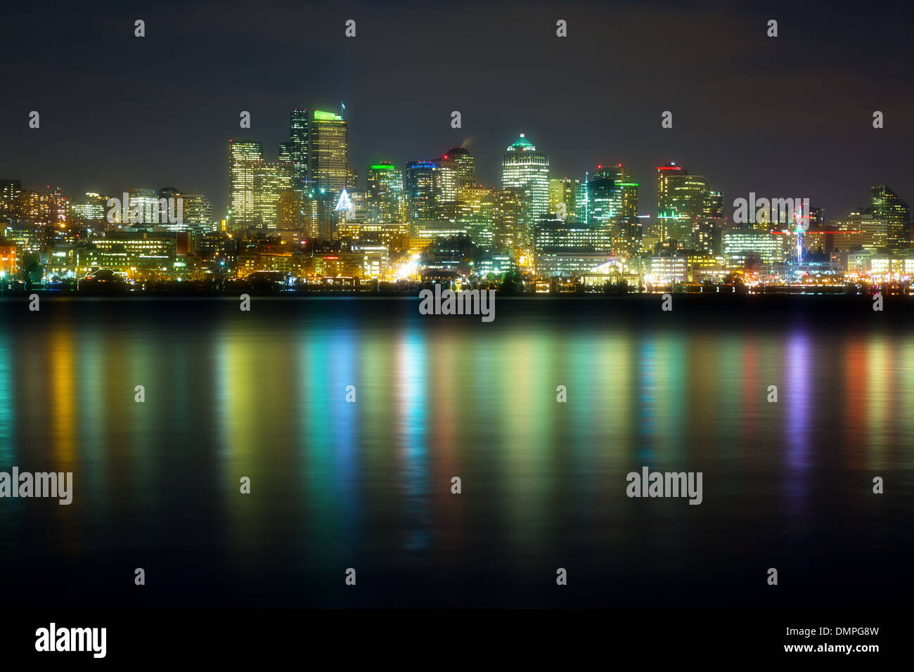 panorama of the city at night reflected in water, Seattle, USA Stock ...