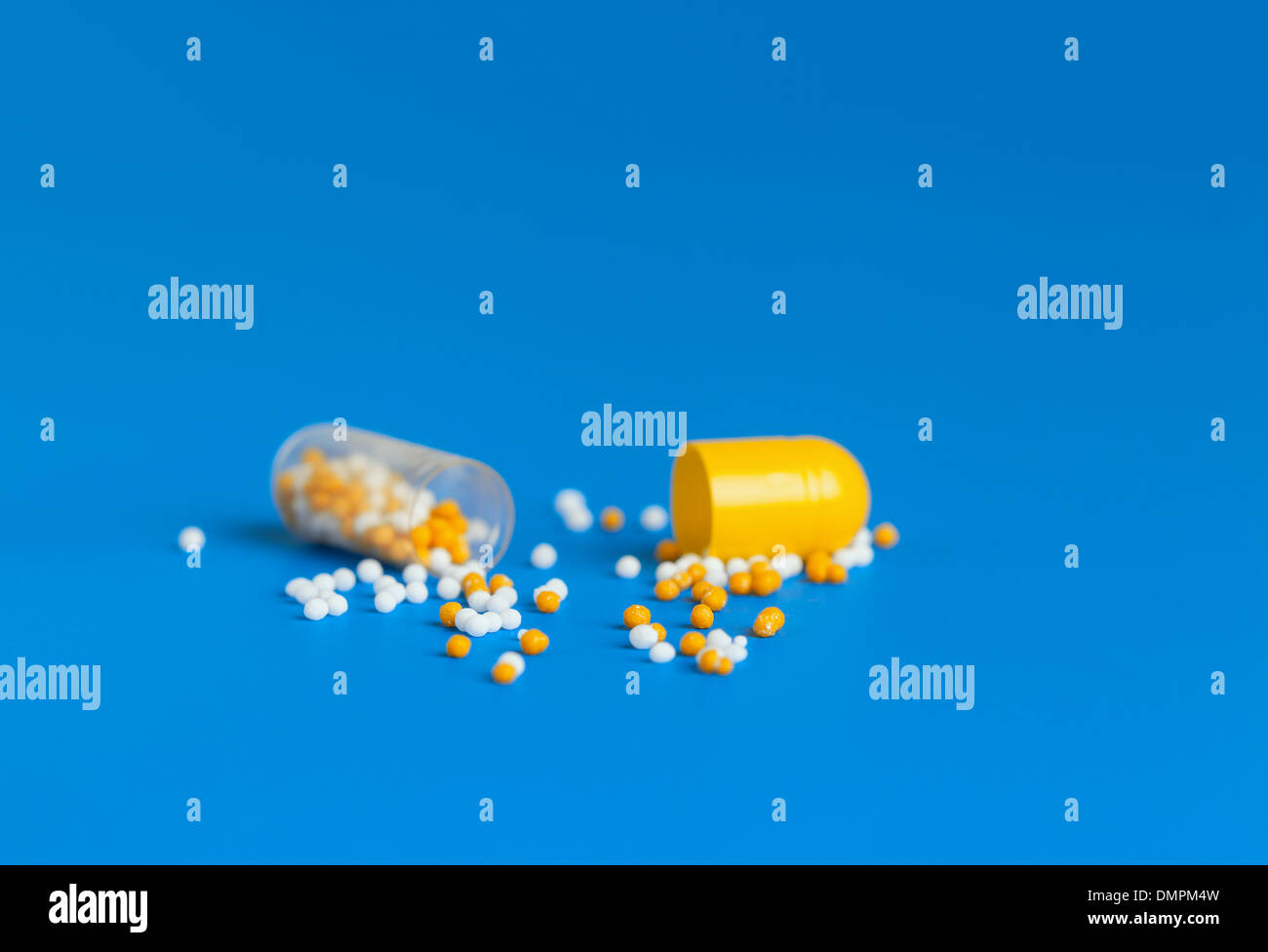 open medicine capsule granules vitamins Stock Photo Alamy