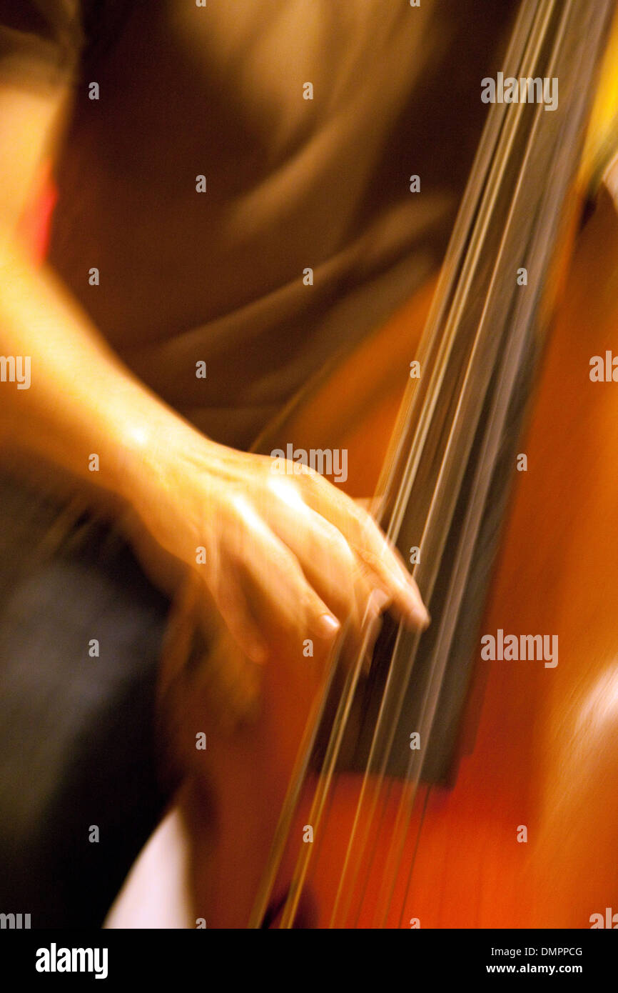 Double Bass player playing his instrument, with motion blur, Cafe Paris, Havana cuba Caribbean Stock Photo