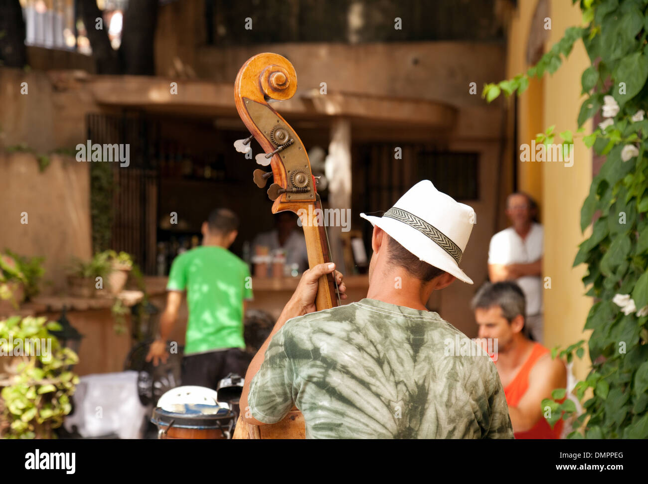 A double bass player playing music in a bar, Trinidad, Cuba, Caribbean, Latin America Stock Photo