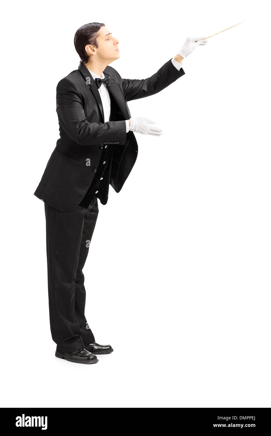 Full length portrait of a male orchestra conductor directing with stick Stock Photo