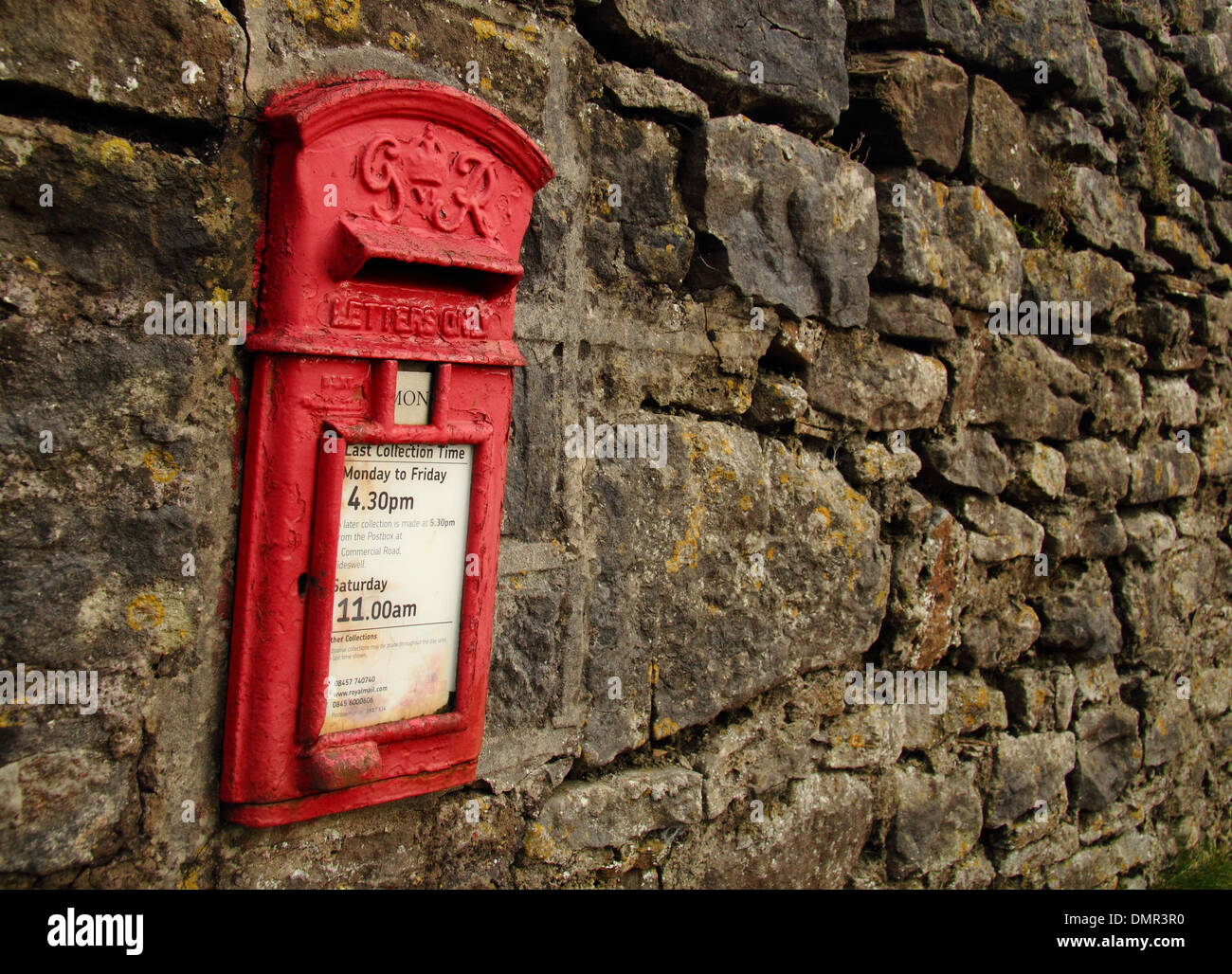 George VI post box built into stone wall in Grindlow, a hamlet in the heart of Derbyshire's Peak Dstrict, UK. Stock Photo