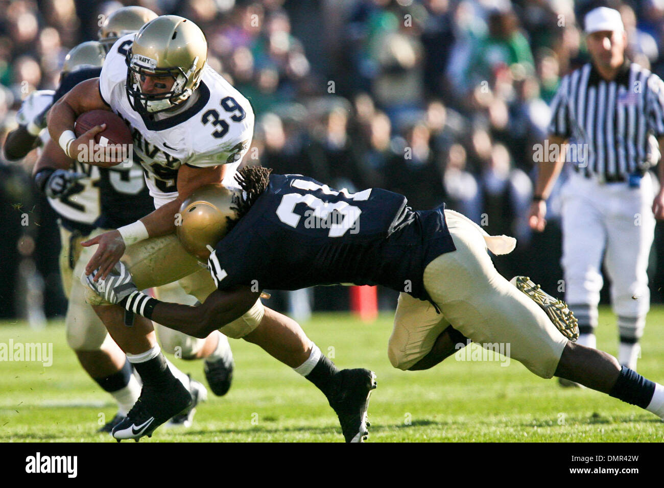 Navy fullback Alexander Teich (39) is tackled by Notre Dame safety