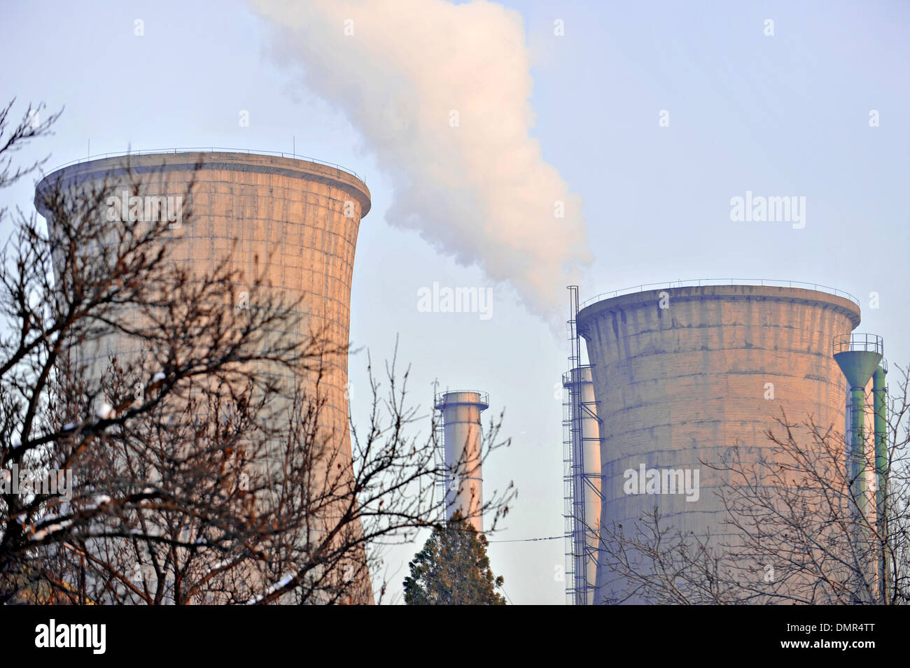 Thermoelectric plant cooling towers with smoke coming out Stock Photo