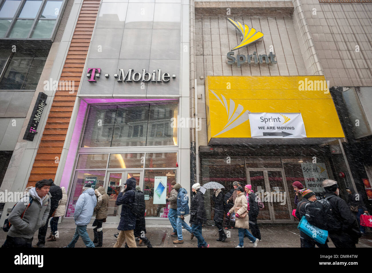 T-Mobile and a former Sprint cellular phone store adjoin each other in Herald Square in New York Stock Photo