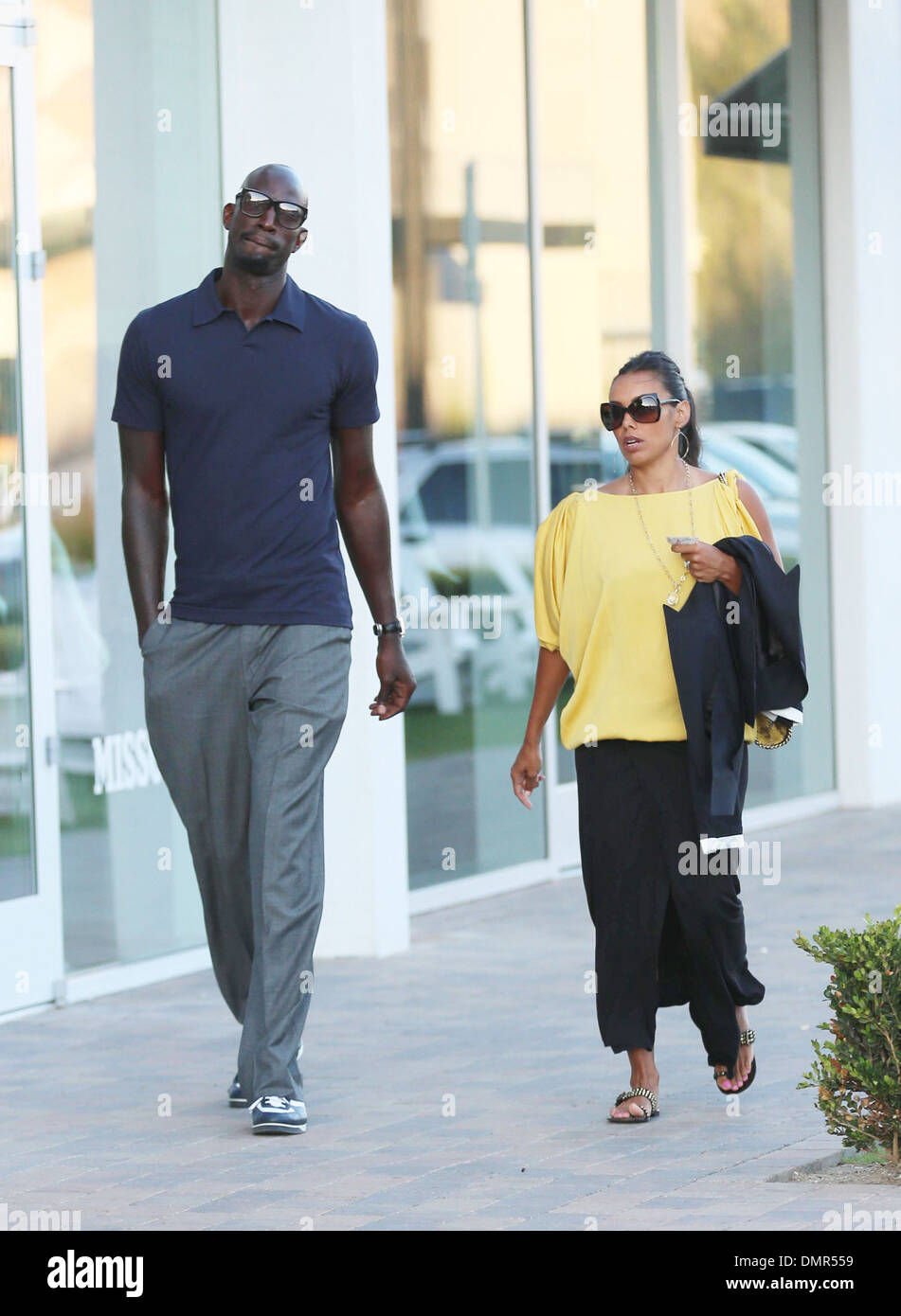 Boston Celtics center Kevin Garnett walks around Malibu Country Mart with his wife Brandi Padilla Los Angeles California - Stock Photo