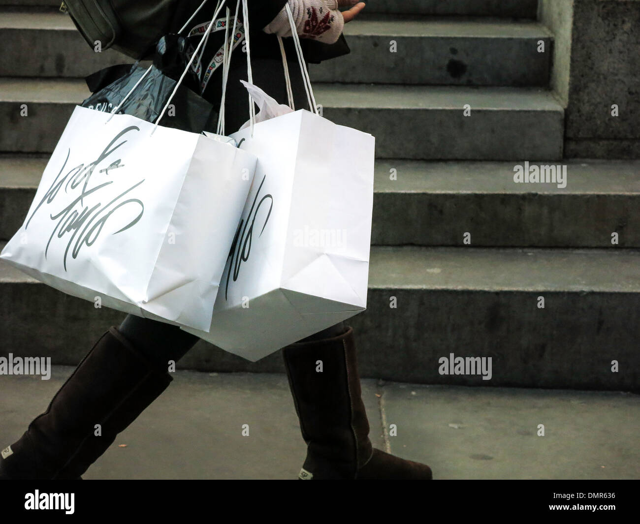 Shopper Carrying Lord & Taylor Shopping Bags in New York City Stock Photo