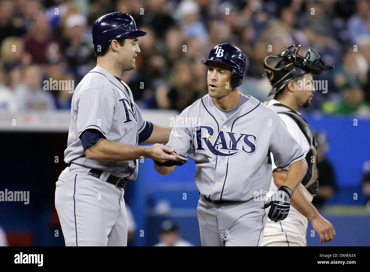Tampa Bay Rays designated hitter Pat Burrell (L) homered and congratulates  teammate Gabe Kapler (R) after he scored against the Toronto Blue Jays at  the Rogers Centre in Toronto, ON. The Blue