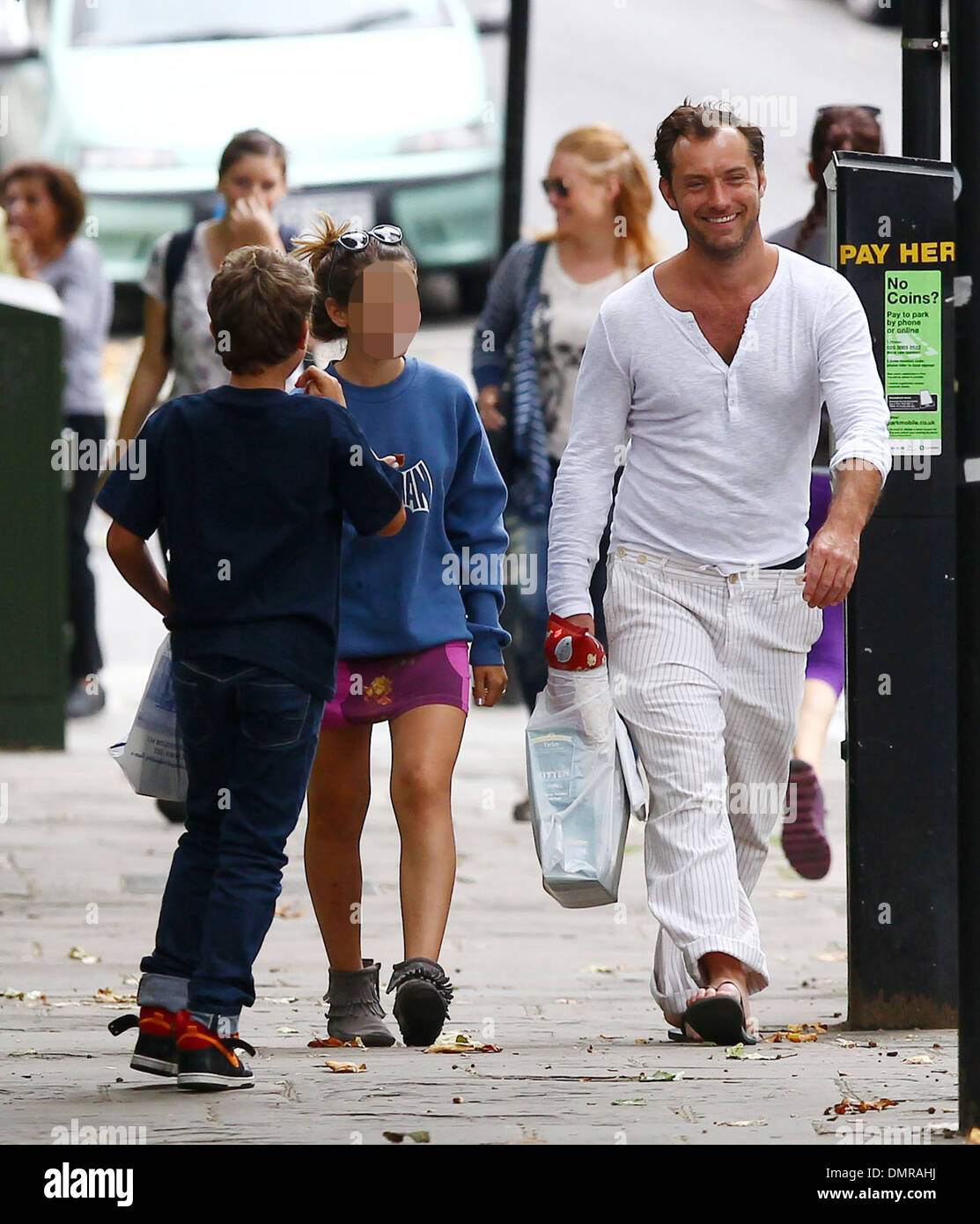 Jude Law with his daughter Iris and son Rudy walking through Primrose Hill in London London England - 13.08.12 Stock Photo