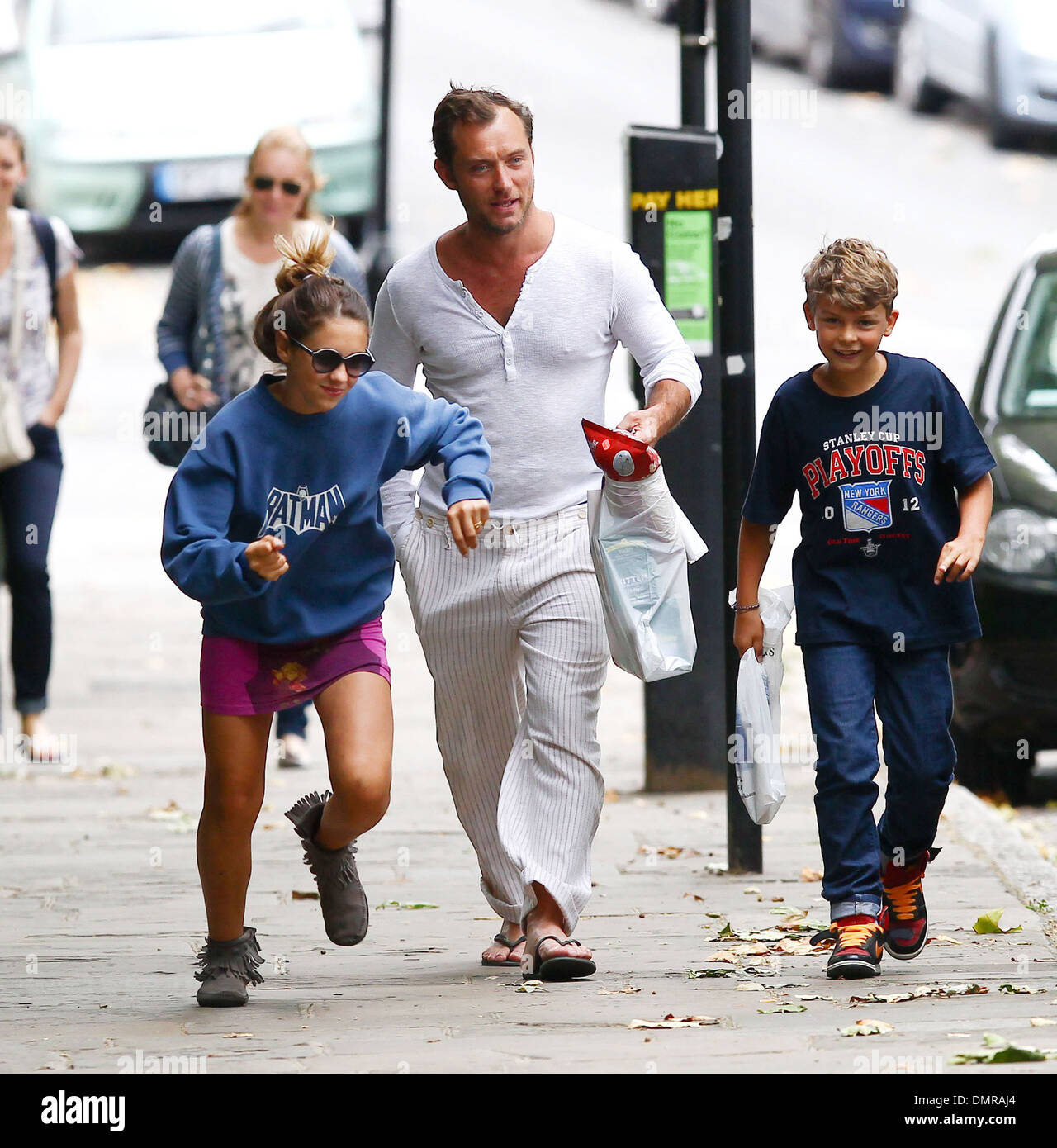Jude Law with his daughter Iris and son Rudy walking through Primrose ...