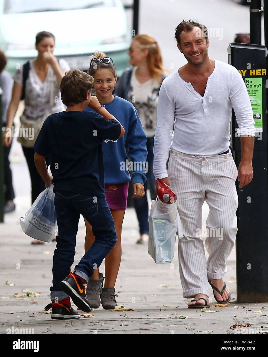 Jude Law with his daughter Iris and son Rudy walking through Primrose Hill in London London England - 13.08.12 Stock Photo