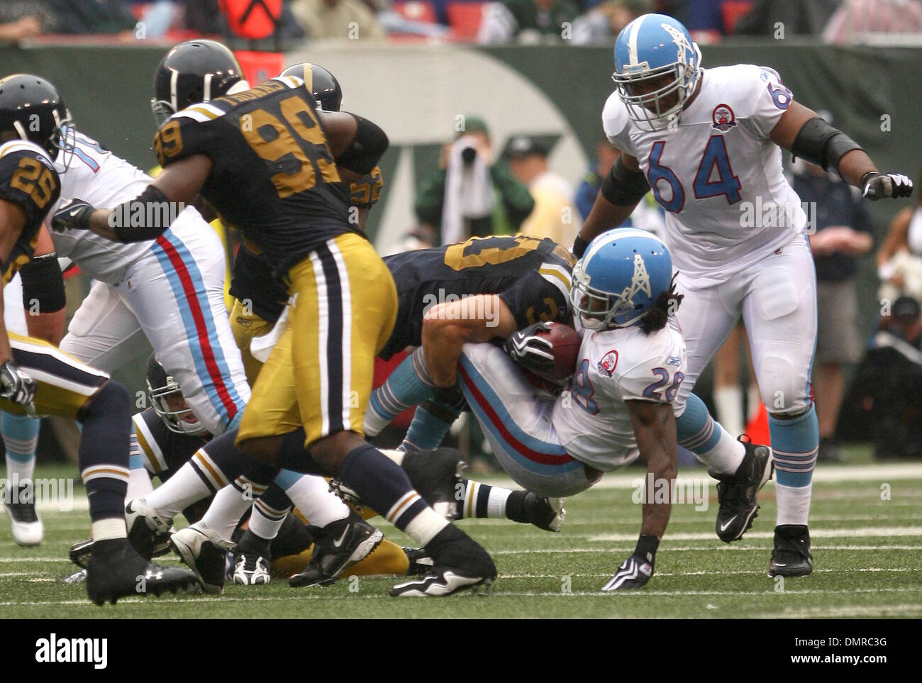 27 September 2009: Tennessee Titans #28 Chris Johnson gets caught. The New  York Jets defeated the Tennessee Titans 24-17 at Giants Stadium in  Rutherford, New Jersey. In honor of AFL Legacy weekend