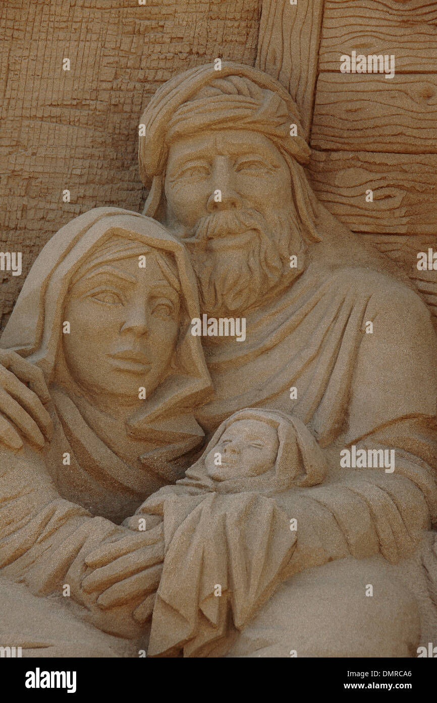 a close up of a sand sculpture nativity, depicting Joseph, Mary and