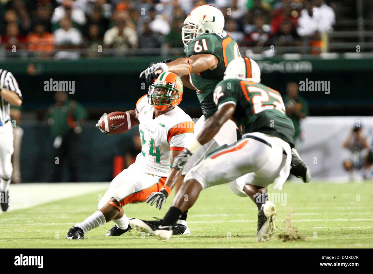 Florida A&M cornerback Curtis Holcomb (24) attempts to out run Miami ...