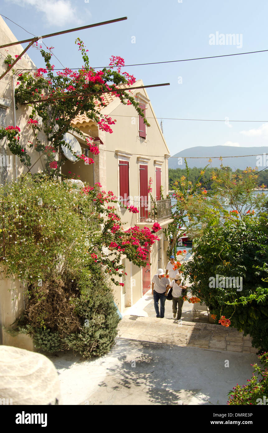 Couple walking along a street in Fiskardo, Kefalonia, Ionian Islands, Greece Stock Photo