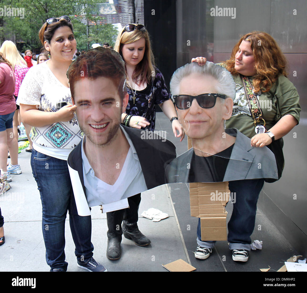 Fans with giant cardboard cutouts New York Premiere of 'Cosmopolis' held at Museum of Modern Art