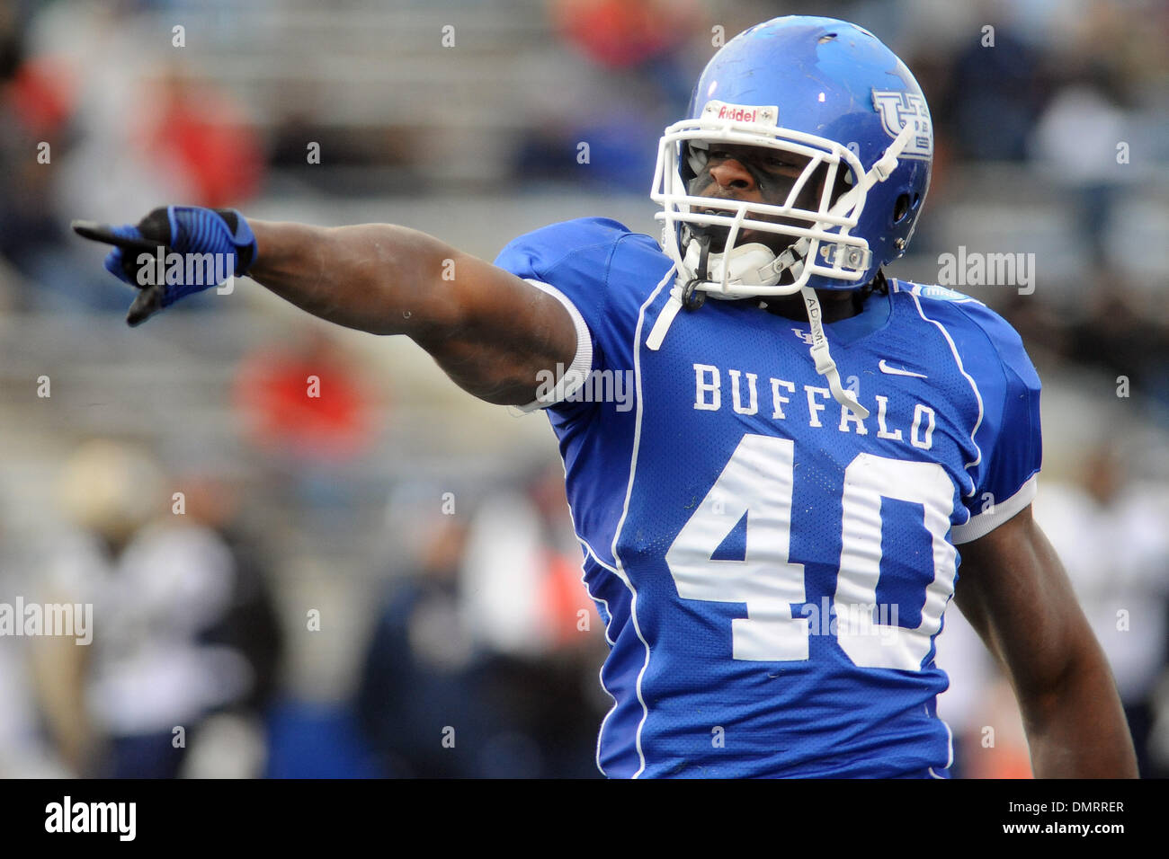 Buffalo defensive lineman Steven Means (40) points to the fans after sacking Akron quarterback