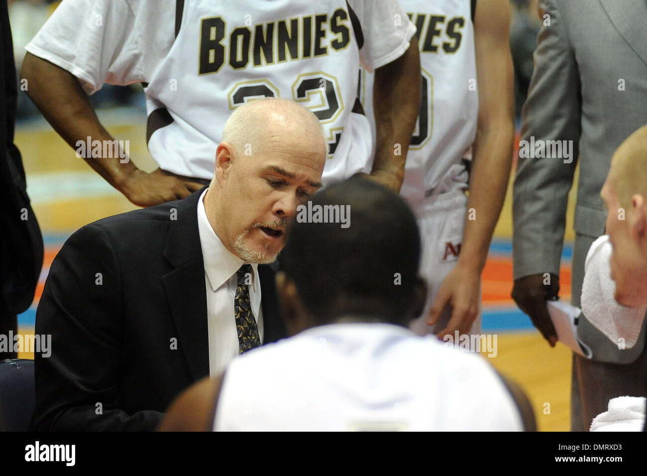 St. Bonaventure head coach Mark Schmidt draws up a play during a time