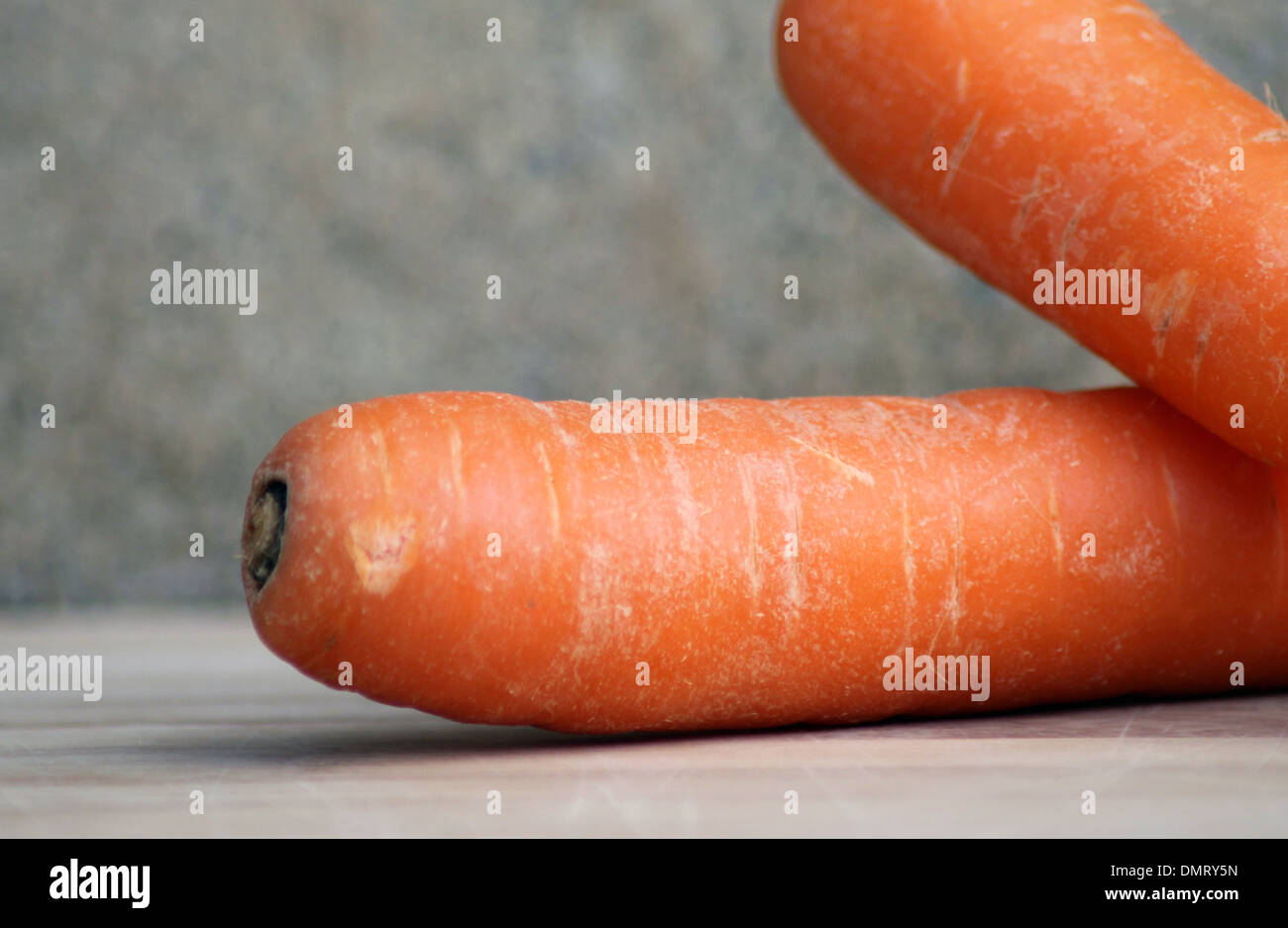 Closeup of ripe carrots on studio background. Stock Photo