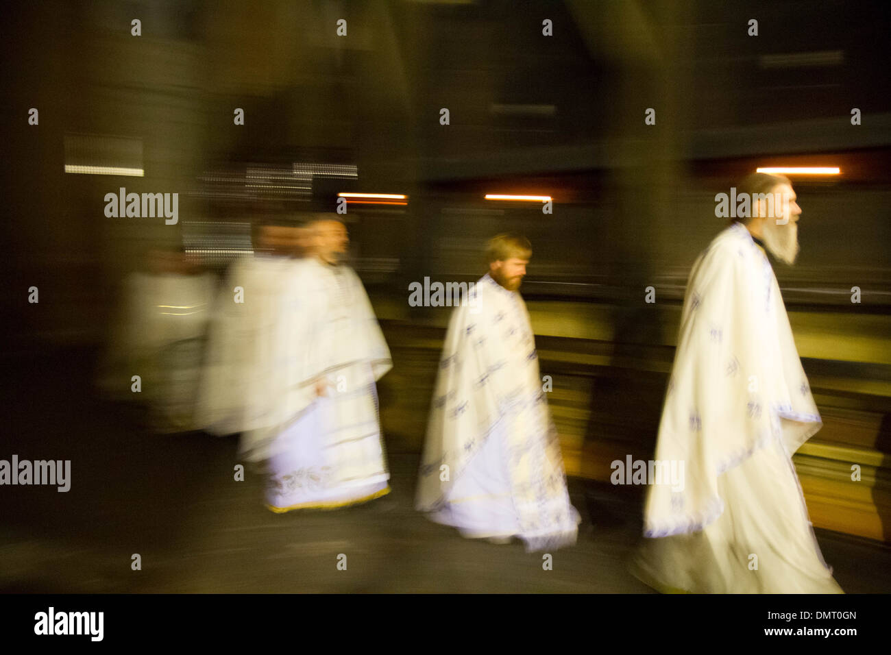 Orthodox Christian priests performing a night liturgy around the