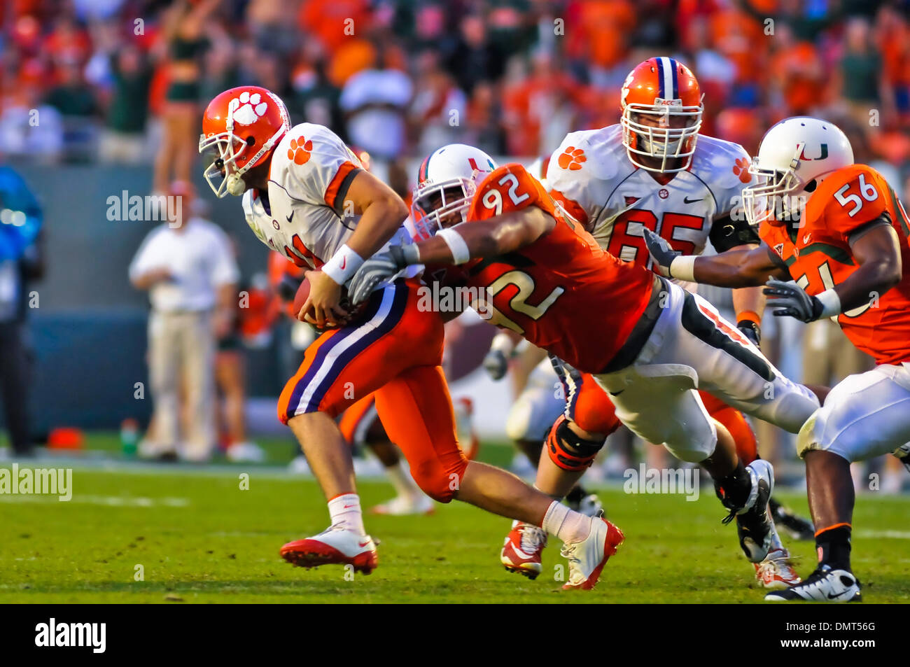 Clemson QB Kyle Parker # 11 gets tackeled by Miami DL Josh Holmes #92. Clemson 40 defeated  Miami (FL) 37 in OT at Landshark Stadium in Miami, Fl. (Credit Image: © Lou Novick/Southcreek Global/ZUMApress.com) Stock Photo