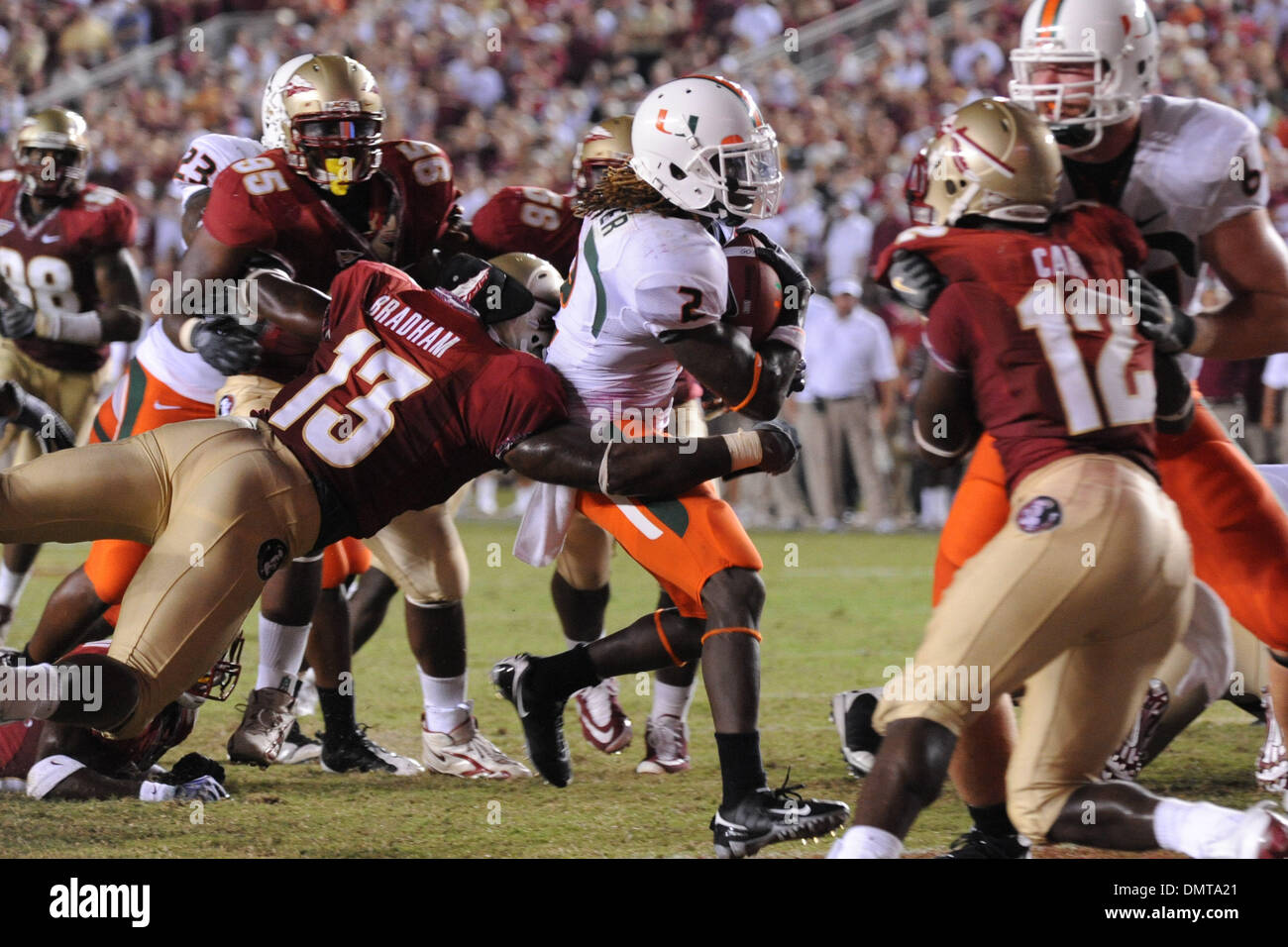 Miami running back, Graig Cooper, runs in for a touchdown during Monday