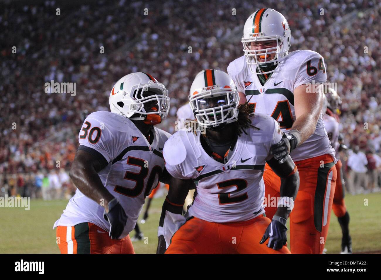 Miami running back, Graig Cooper, celebrates a rushing touchdown during