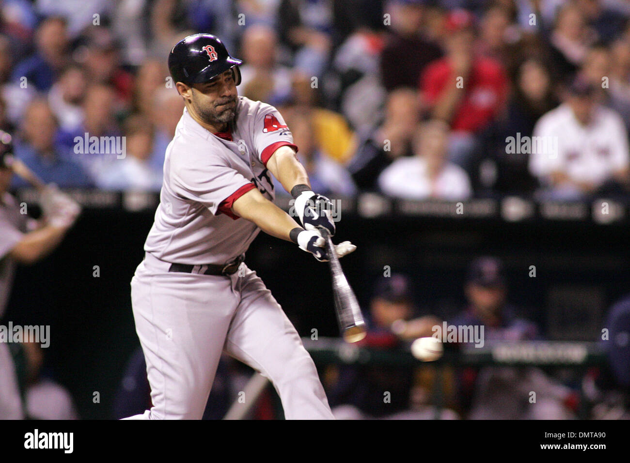 Boston Red Sox third baseman Mike Lowell reaches for an outside