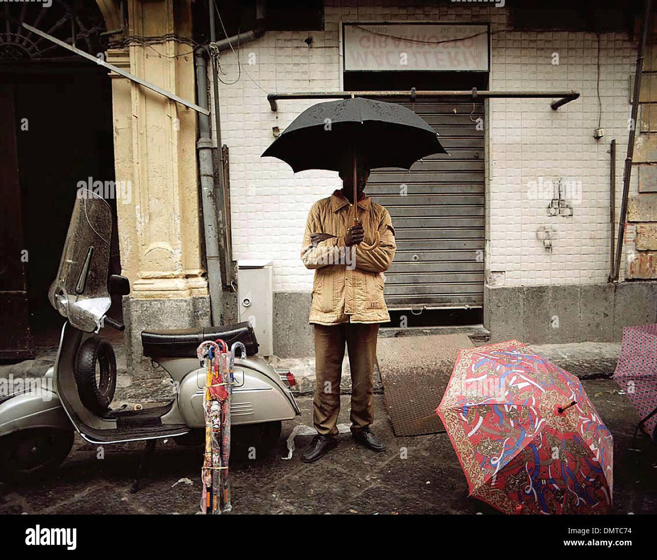Umbrella seller on the side of the street in Sicily Italy Stock