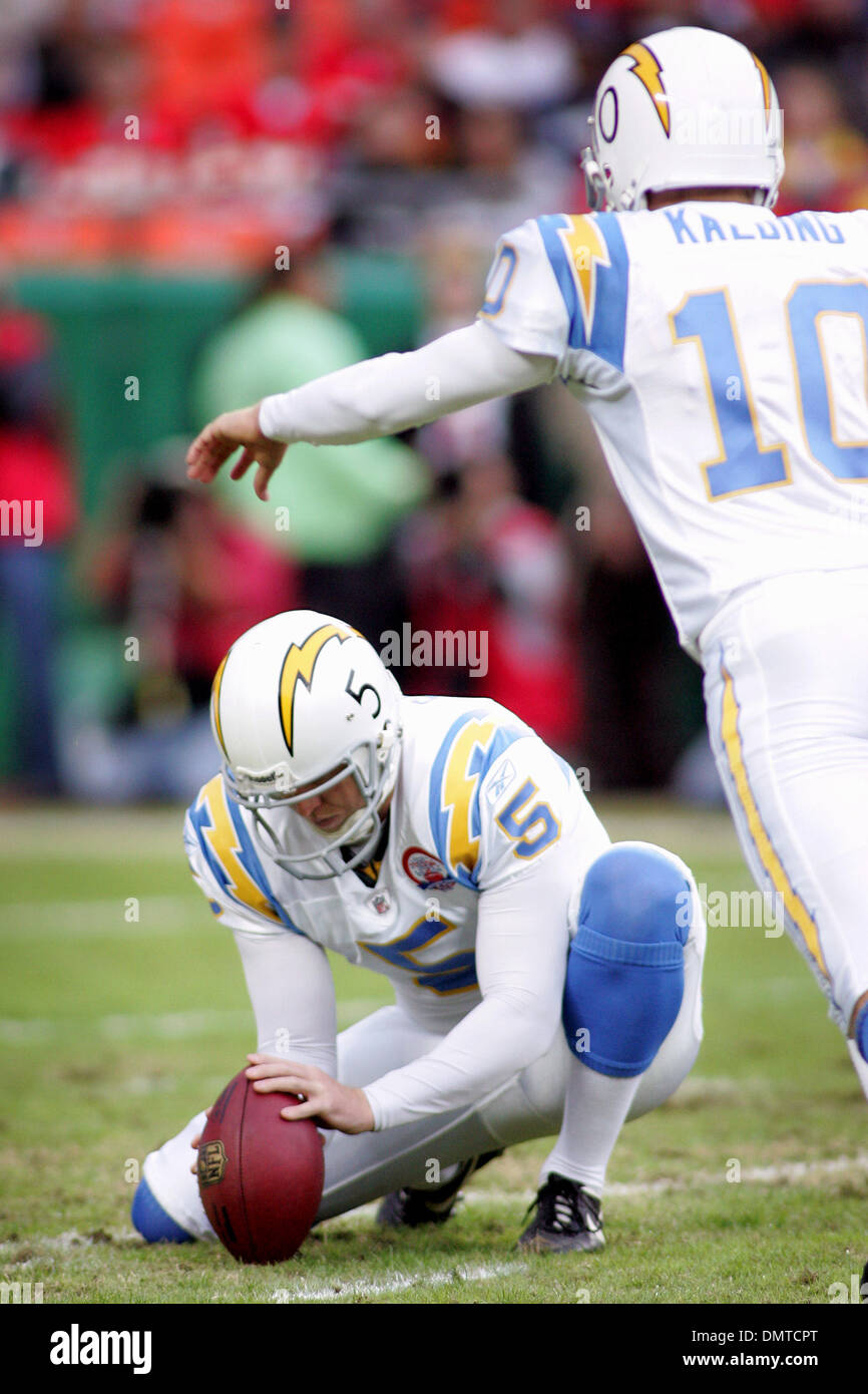 San Diego Chargers punter Mike Scifres (5) holds the ball for kicker
