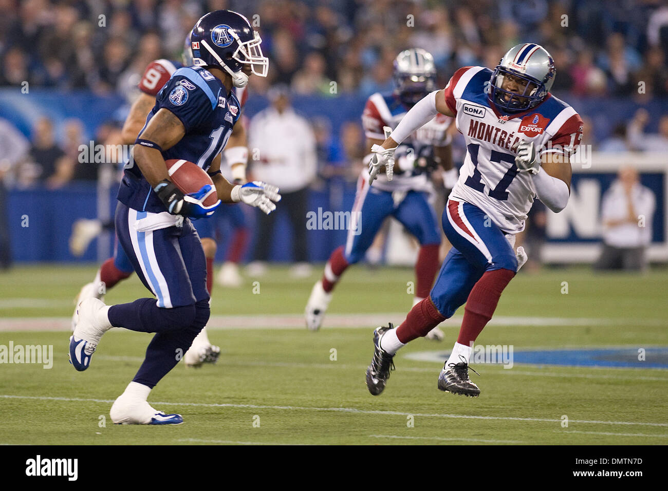 Toronto Argonauts wide receiver Jason Carter #19 runs with the ball as Montreal Alouettes defensive back Billy Parker #17 gives chase during a CFL game between the Toronto Argonauts and the Montreal Alouettes at the Rogers Centre in Toronto. (Credit Image: © Nick Turchiaro/Southcreek Global/ZUMApress.com) Stock Photo