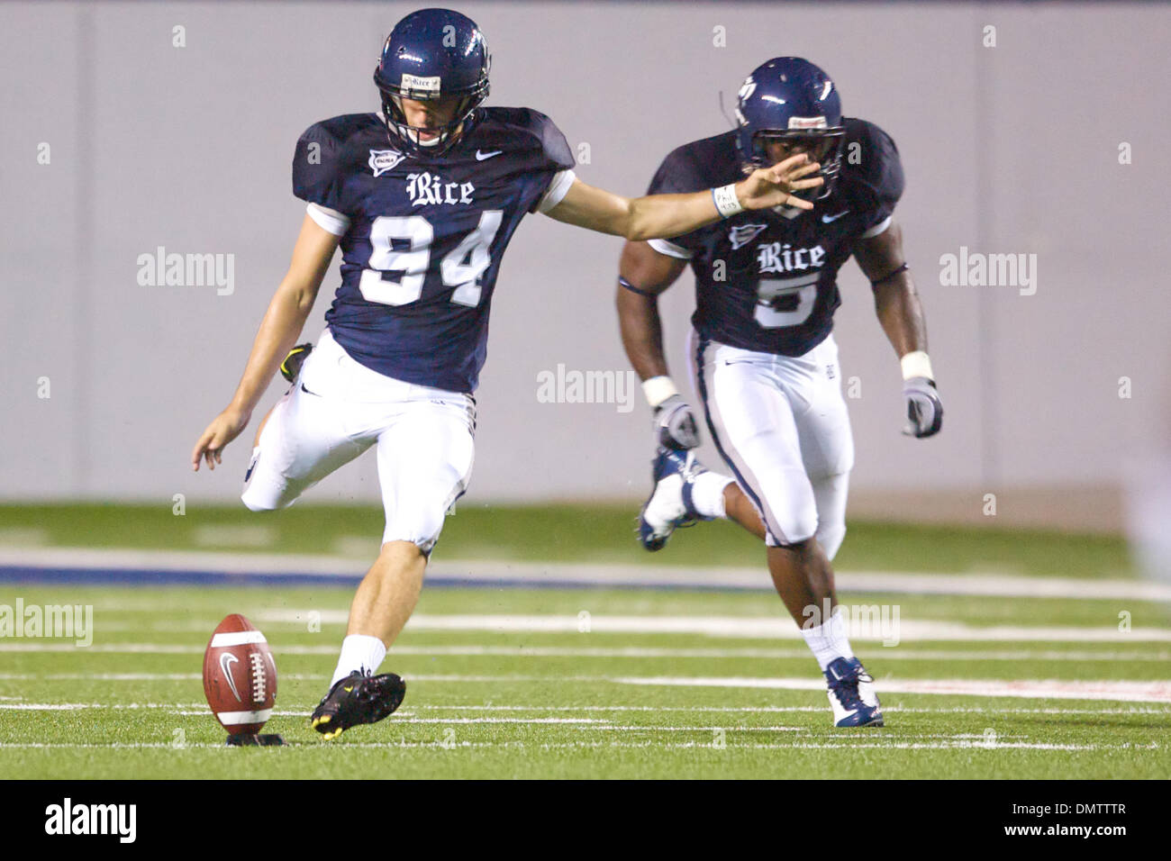 Brandon Yelovich (94) of the Rice Owls on a kickoff in the rain. The