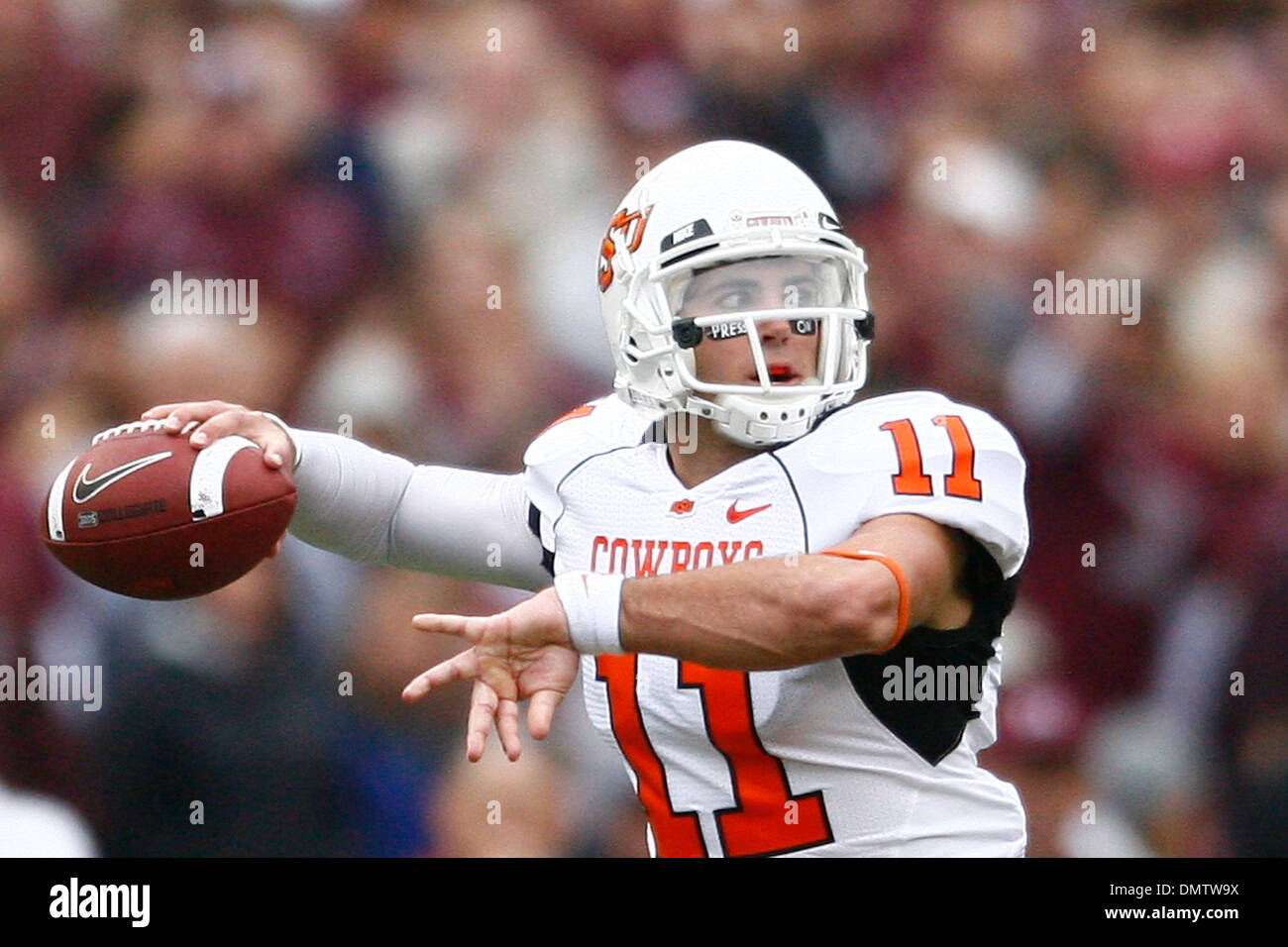 Zac Robinson (11) of the Oklahoma State University Cowboys winds up