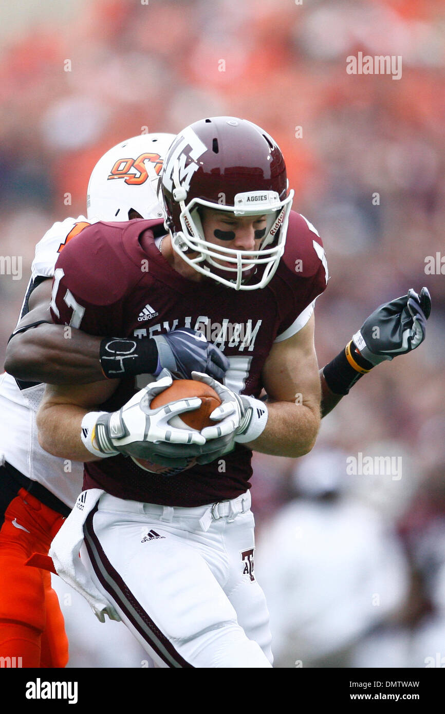 Ryan Tannehill (#17) of the Texas A&M University Aggies is brought down ...