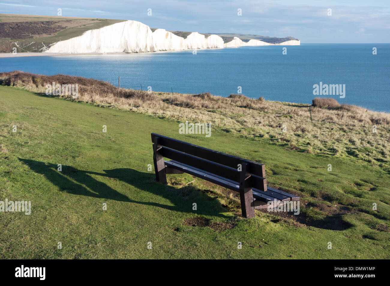 An bench overlooks the chalk cliffs of the Seven Sisters, South Downs National Park, East Sussex, England Stock Photo