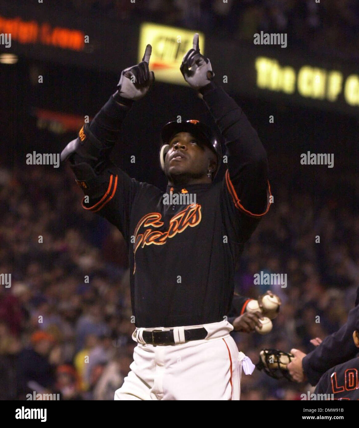 Mar 28, 2002; San Francisco, CA, USA; San Francisco Giants' Barry Bonds,  #25, points to the sky after hitting a homerun in the 4th inning of their  exhibition game against the Oakland