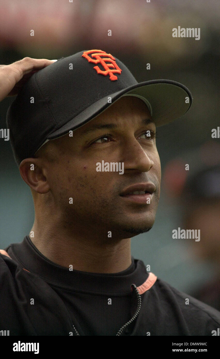 Hall of Fame San Francisco Giants player Willie Mays (L) doffs his cap to  fans while Willie McCovey (R) and Will Clark applaud during a ceremony to  retire Giant Barry Bonds' number 25 in San Francisco on August 11, 2018.  Photo by Terry Schmitt/UPI Sto