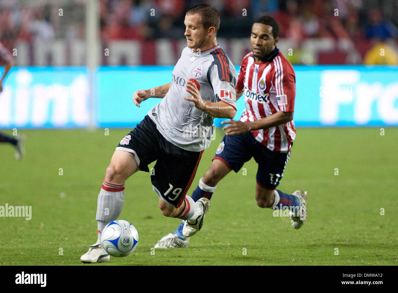 Aug. 22, 2009 - Carson, California, U.S - Chad Barrett (L) dribbles away from Maykel Galindo (R) during the MLS game between Toronto FC and Chivas USA at the Home Depot Center. (Credit Image: © Brandon Parry/Southcreek Global/ZUMAPRESS.com) Stock Photo