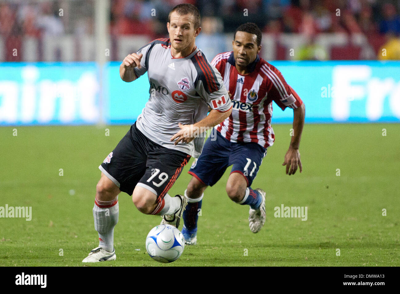 Aug. 22, 2009 - Carson, California, U.S - Chad Barrett (L) dribbles away from Maykel Galindo (R) during the MLS game between Toronto FC and Chivas USA at the Home Depot Center. (Credit Image: © Brandon Parry/Southcreek Global/ZUMAPRESS.com) Stock Photo