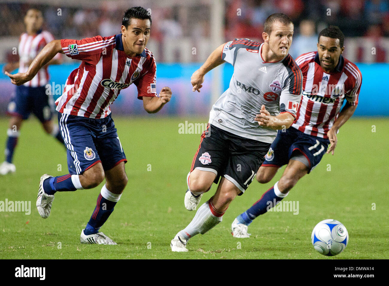 Aug. 22, 2009 - Carson, California, U.S - Chad Barrett (mid) dribbles away from Maykel Galindo (R) and Jesus Padilla (L) during the MLS game between Toronto FC and Chivas USA at the Home Depot Center. (Credit Image: © Brandon Parry/Southcreek Global/ZUMAPRESS.com) Stock Photo