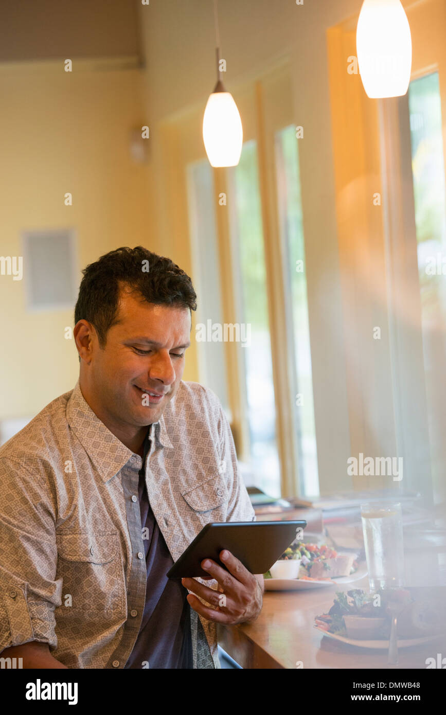 A man using a digital tablet. Stock Photo