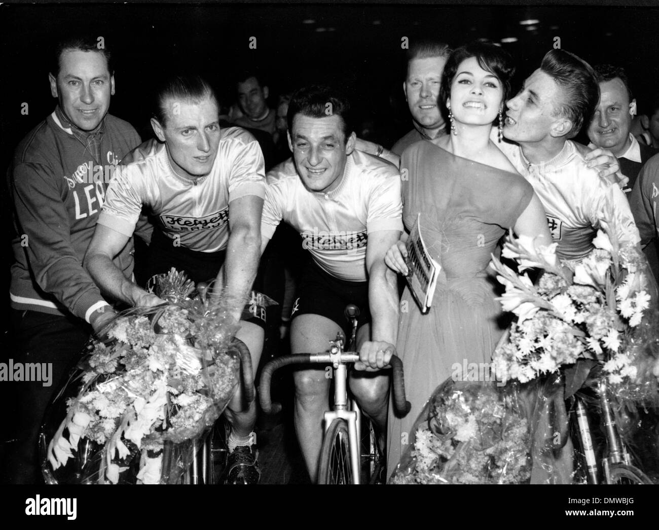 Nov. 14, 1958 - Paris, France - JACQUES ANQUETIL, ANDRE DARRIGADE and FERDINANDO TERRUZI, the Franco-Italians won the Paris 'Six Days' cycling race last night. PICTURED: (from L-R) Darrigade, Terruzi and Anquetil congratulated by MICHELE MERCIER, the queen of the 'Six Days'.  (Credit Image: © KEYSTONE Pictures USA/ZUMAPRESS.com) Stock Photo