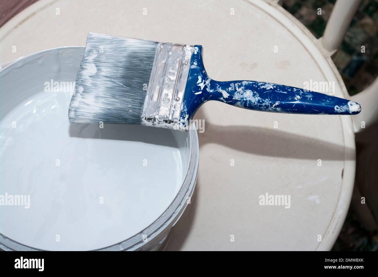Paint Brush On An Open Tin Of Emulsion paint Stock Photo Alamy